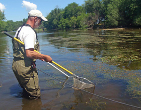 Photo of Rick Frye electrofishing